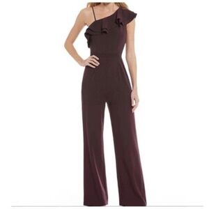 Like new Antonio Melani one ruffle shoulder jumpsuit, plum